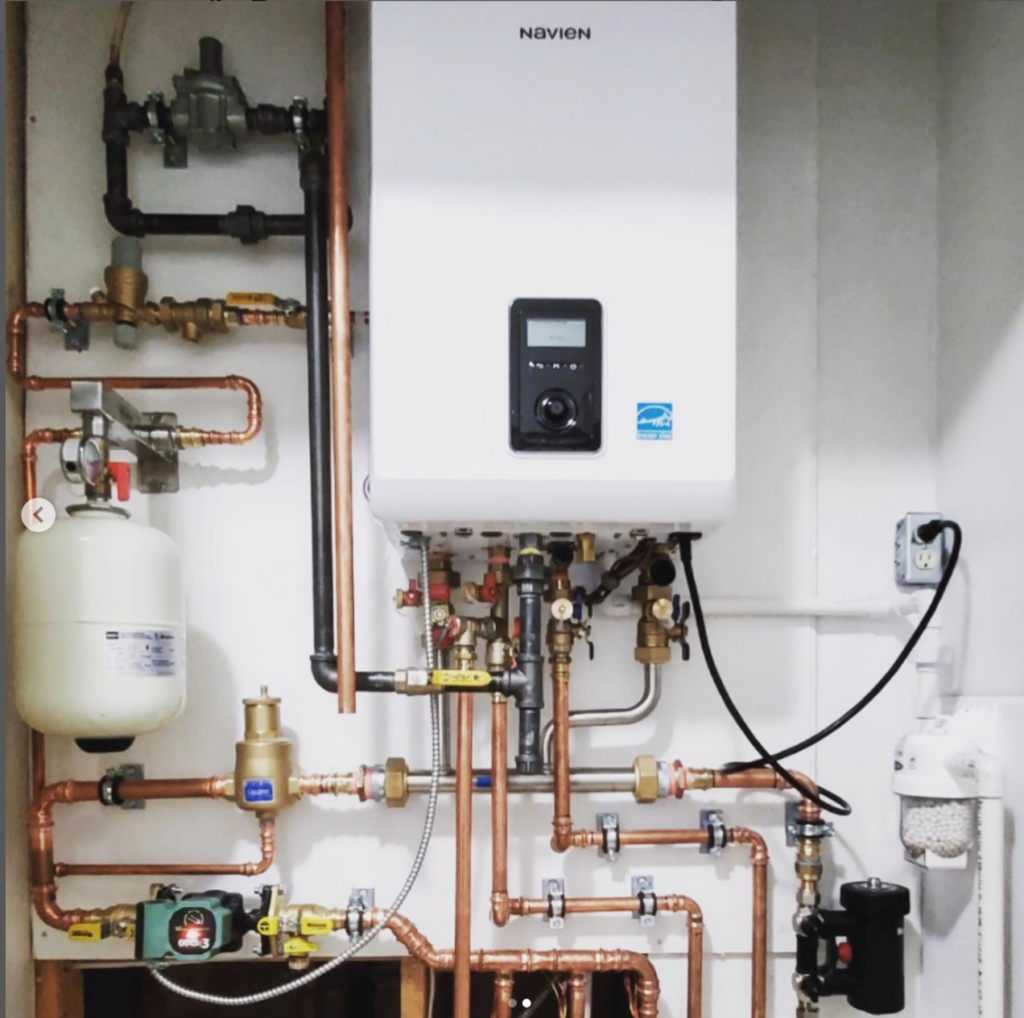 Newly installed Navien combination boiler providing heating and hot water.